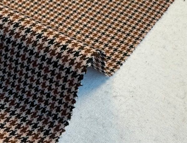 This fabric has a width of 150cm and a weight of 350 (g/m2). It is a woven fabric with a small fragrance texture, perfect for specific uses such as suits, jackets, and cotton clothing. With its medium-heavy weight composition, this fabric offers structure and durability while still providing some breathability, making it suitable for both summer and spring seasons. It provides enough weight to maintain the shape of garments like suits and jackets, ensuring they look polished and sharp. The Woven Small Fragrance Fabric features a unique texture that adds visual and tactile interest to your clothing items. The small fragrance texture also adds a subtle and pleasant scent to the fabric, enhancing the wearing experience. The fabric’s specialty in suits, jackets, and cotton clothing makes it a versatile choice for creating stylish and comfortable garments. Its medium-heavy weight offers durability and longevity, ensuring your garments withstand regular wear. The Medium-Heavy Weight Woven Small Fragrance Fabric is a practical and reliable option that can be used for creating garments specifically tailored for summer or spring. Its unique texture, medium-heavy weight, and subtle fragrance make it a standout choice for adding sophistication and comfort to your wardrobe.